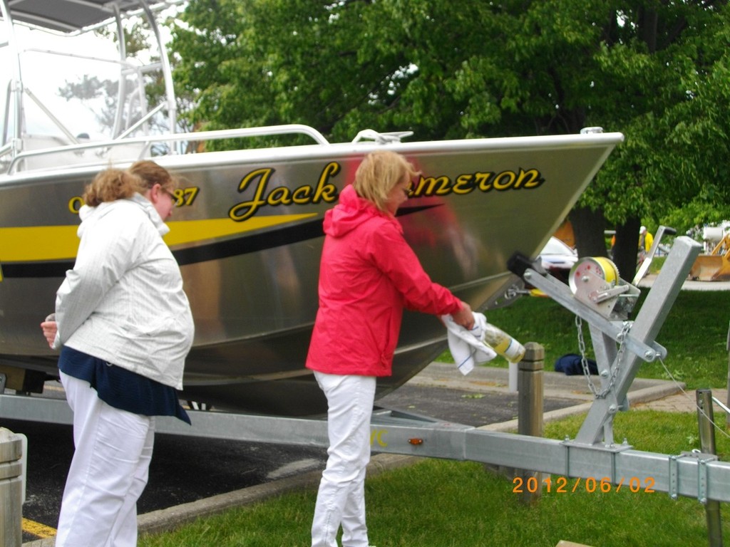 Michelle (daughter) and Melissa (granddaughter) Cameron take a few tries to crack the bubbly - Christening of ABYC mark/pin boat named to honour Jack Cameron © Katie Nicoll